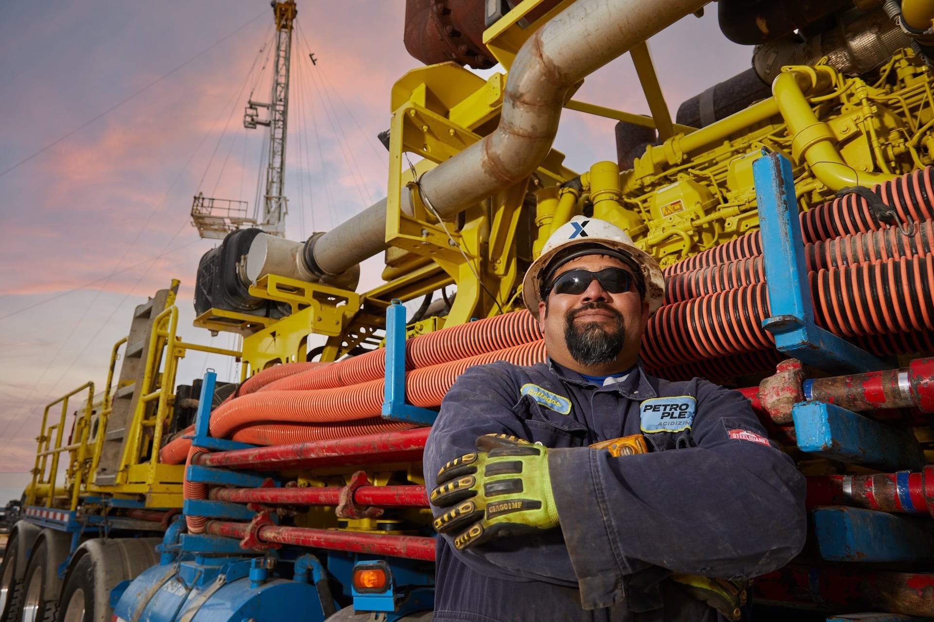 Petroplex worker in front of truck