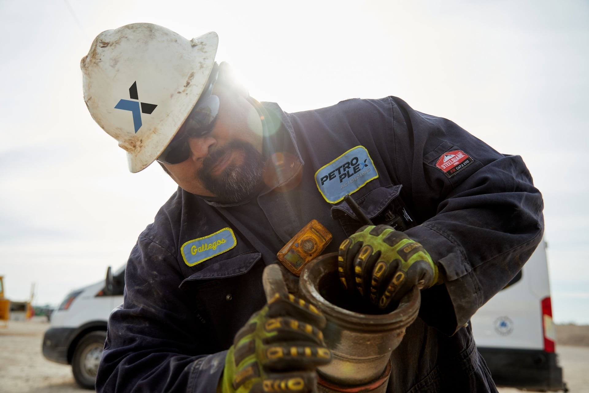 Petroplex worker with hose